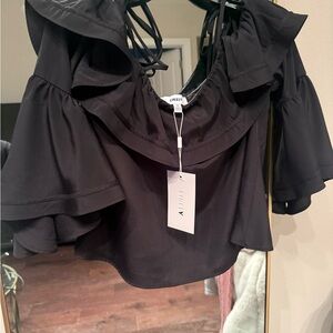 New w tags 🏷️ Likely Black Ruffled Blouse